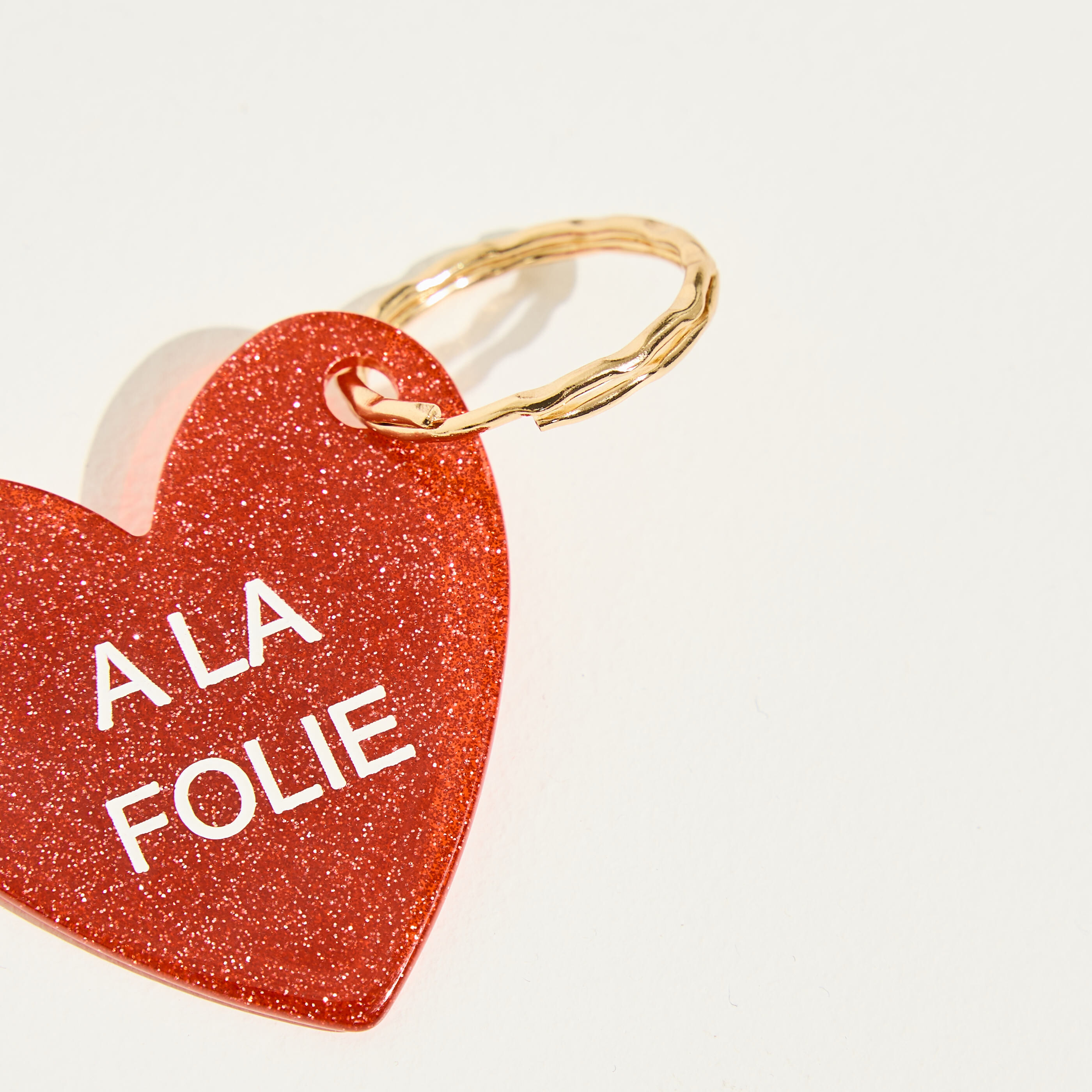Porte-cl&eacute;s c&oelig;ur message A LA FOLIE 