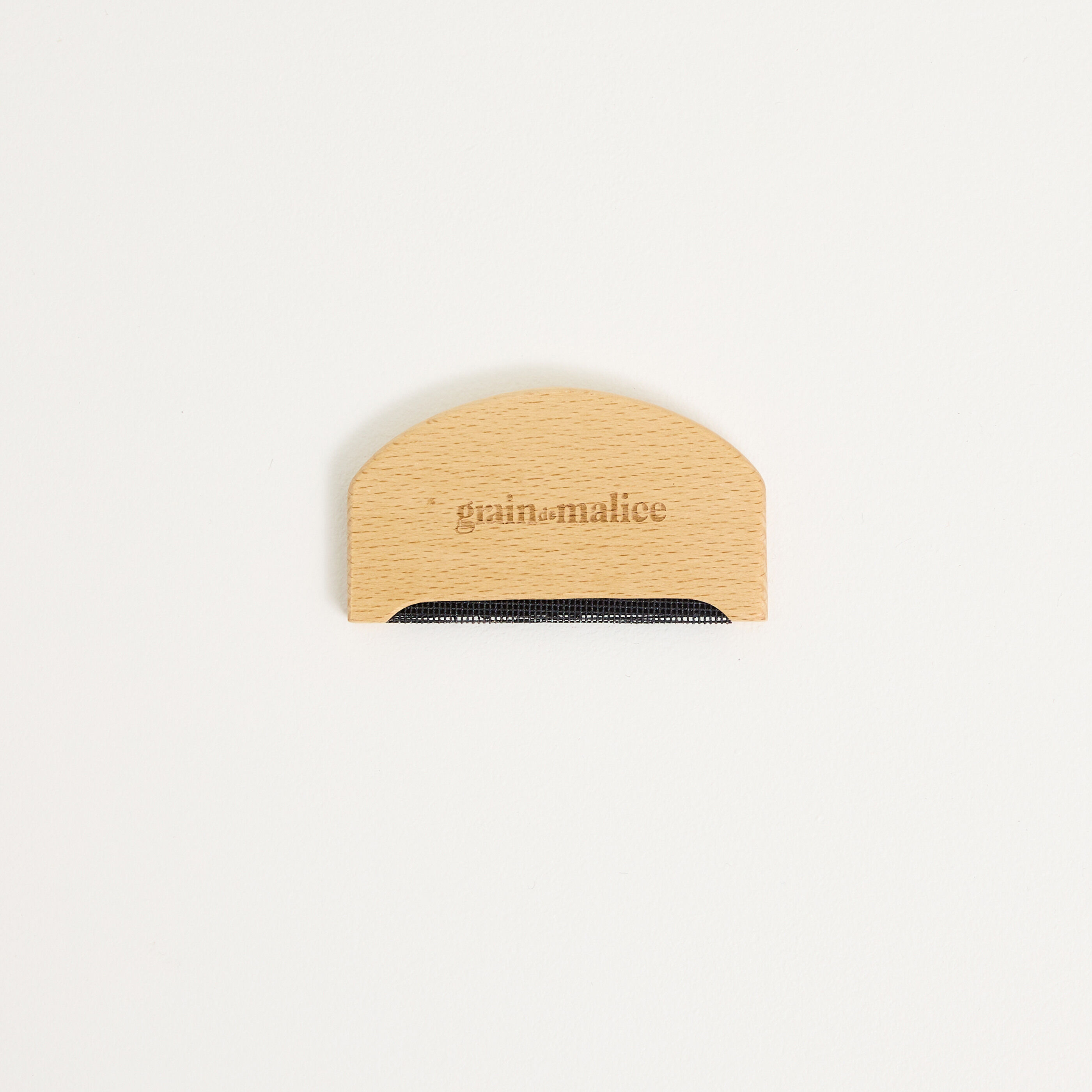 Peigne anti-bouloche femme