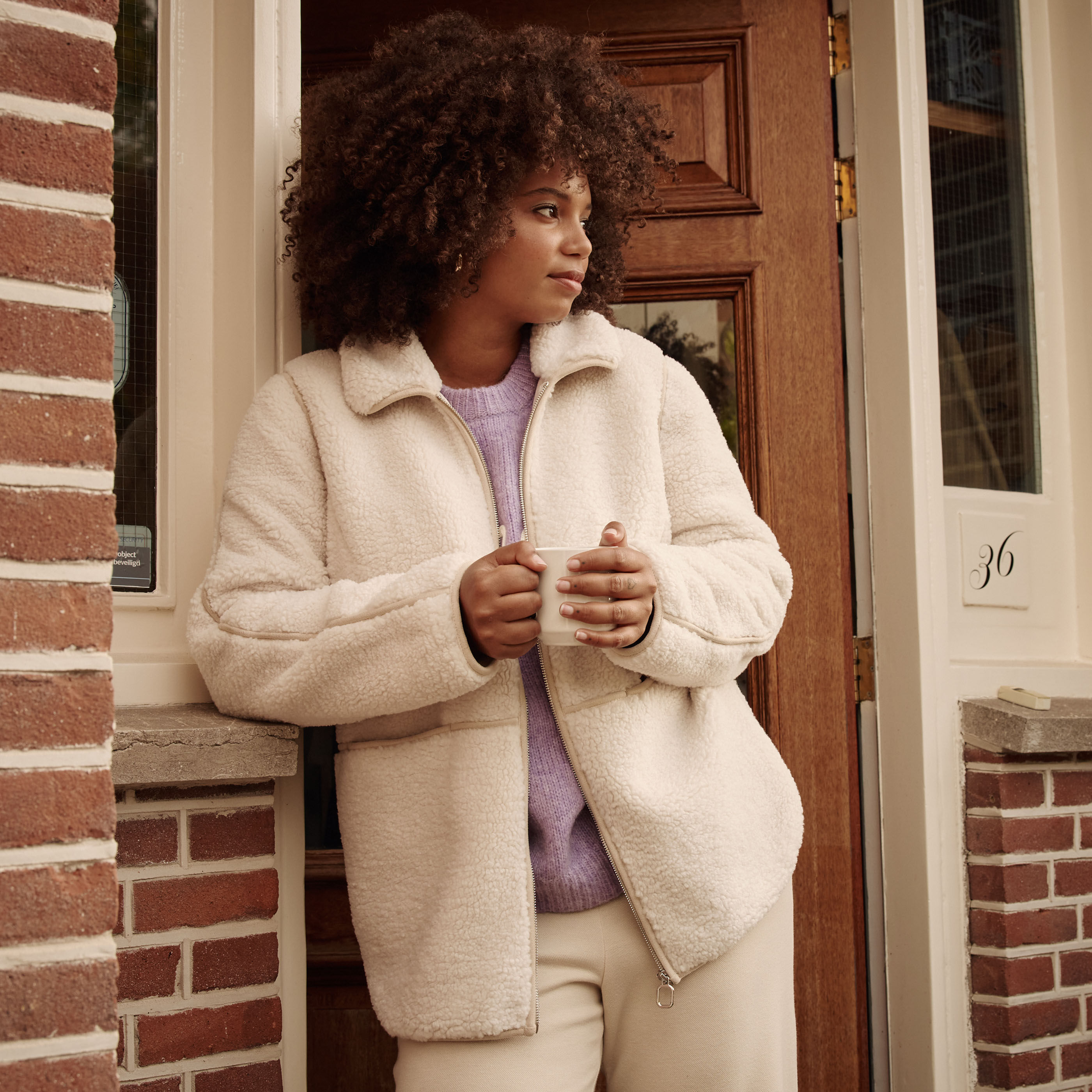 Manteau court bouclette femme