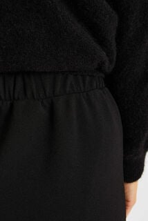 Jupe courte en maille taille élastiquée