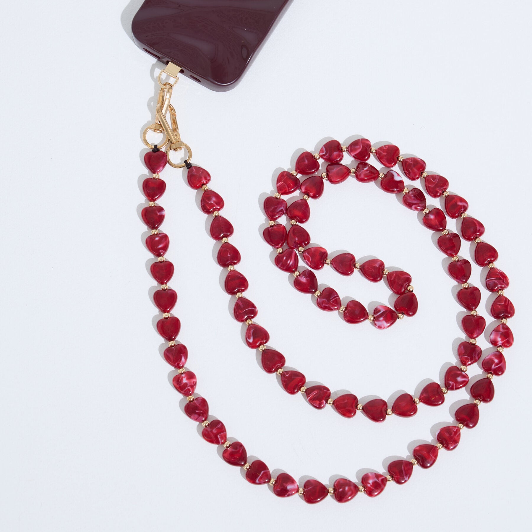Cha&icirc;ne t&eacute;l&eacute;phone &agrave; perles c&oelig;urs femme