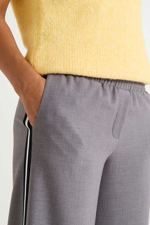 Pantalon avec bandes sur le côté femme